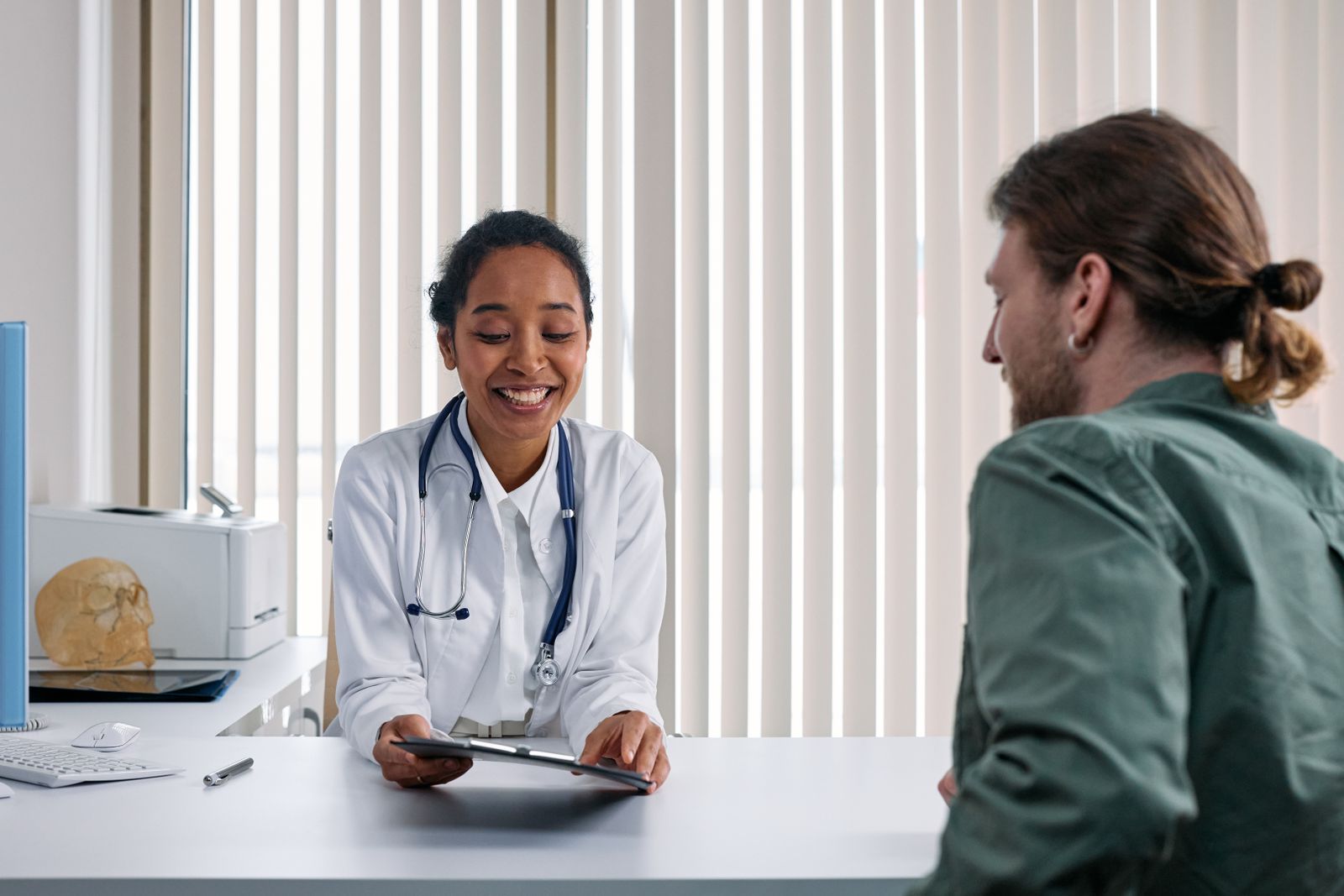 Physician consulting with a patient in a primary care office